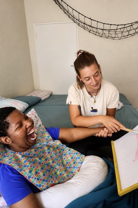 Gabriella Centre caregiver supporting a young attendee